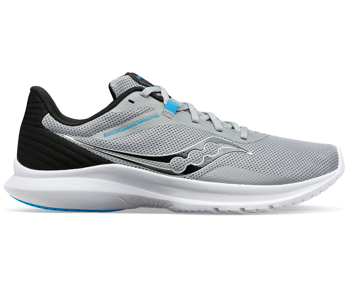 A gray running shoe with a white sole and black heel.