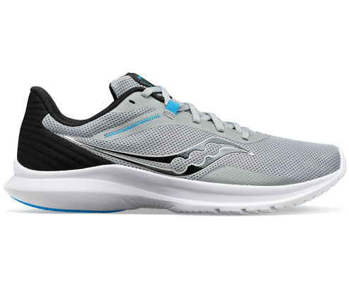 A gray running shoe with a white sole and black heel.