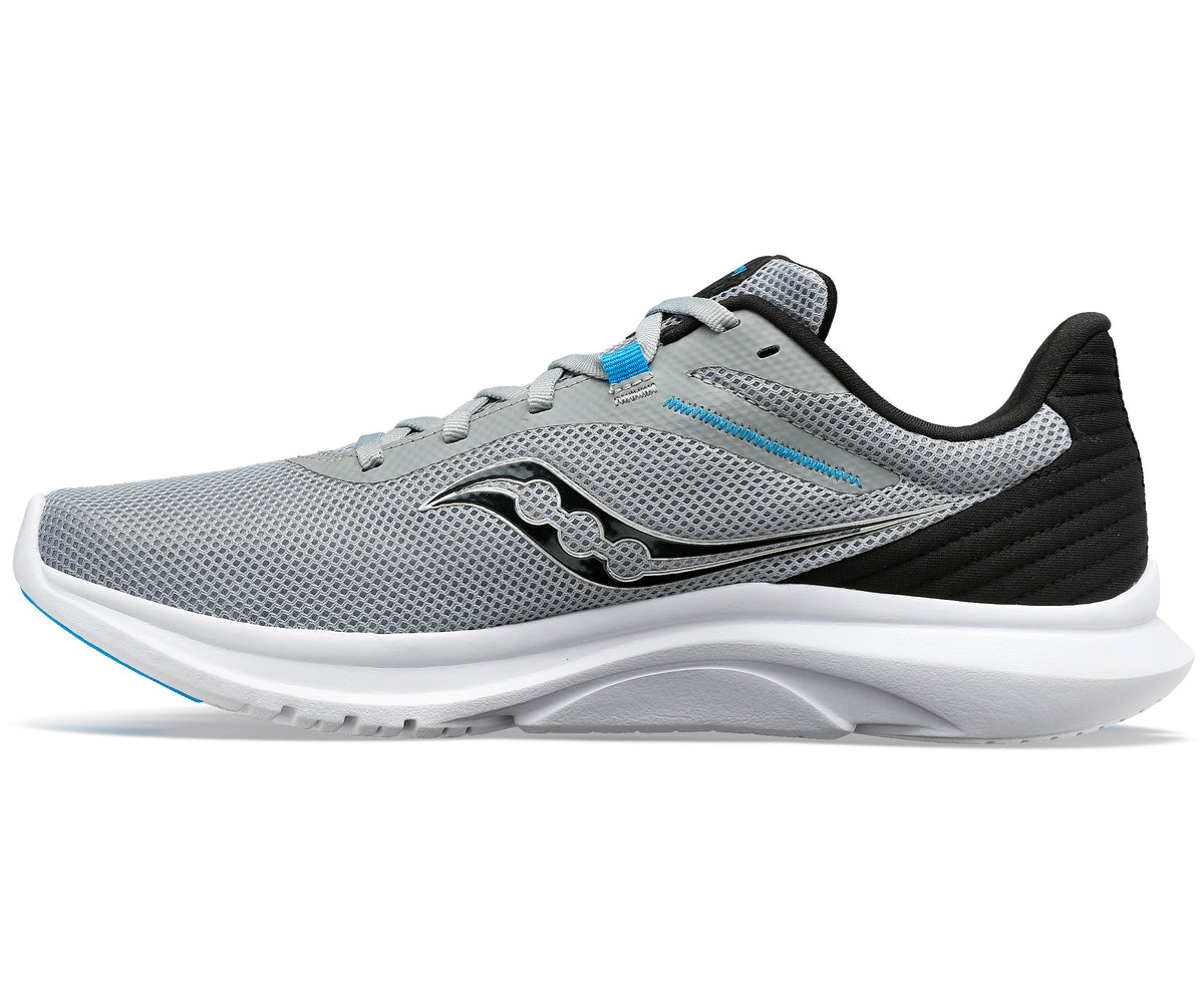 Side view of a gray running shoe with a black logo and heel, and white sole.
