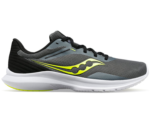 A running shoe featuring a gray mesh upper, black laces and heel, a yellow logo, and a white midsole.