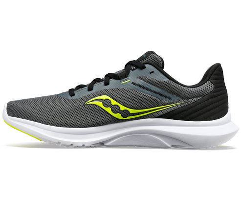 Grey running shoe with yellow logo and white sole
