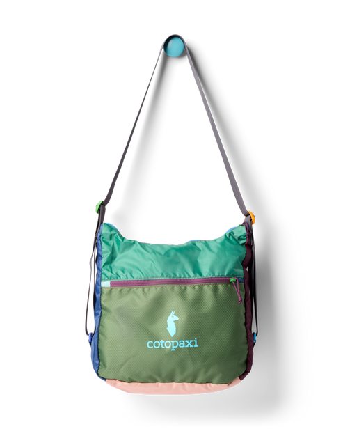 Green, brown, and blue multi-paneled crossbody bag with logo visible on the front.