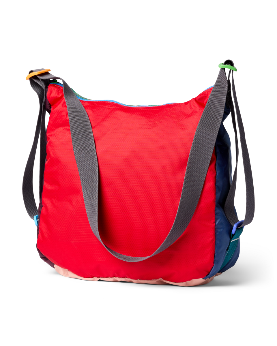 Red, blue, green and beige messenger bag with gray straps.