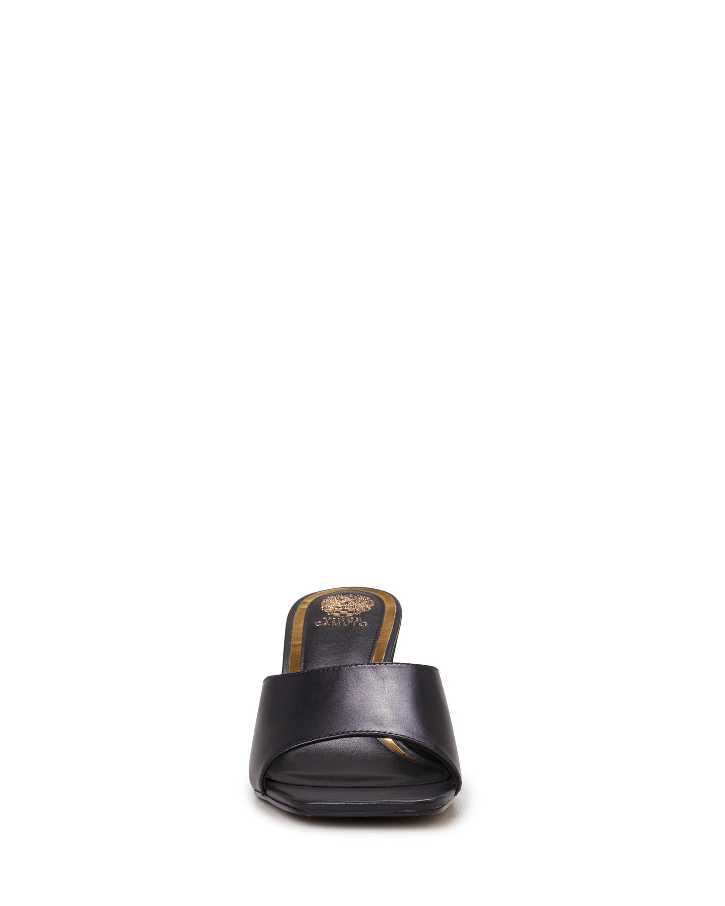 A close-up of a black, open-toed heeled sandal with a gold emblem visible on the insole.
