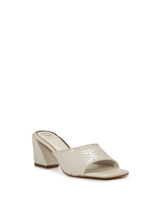 Bone-colored snakeskin mule with a block heel.