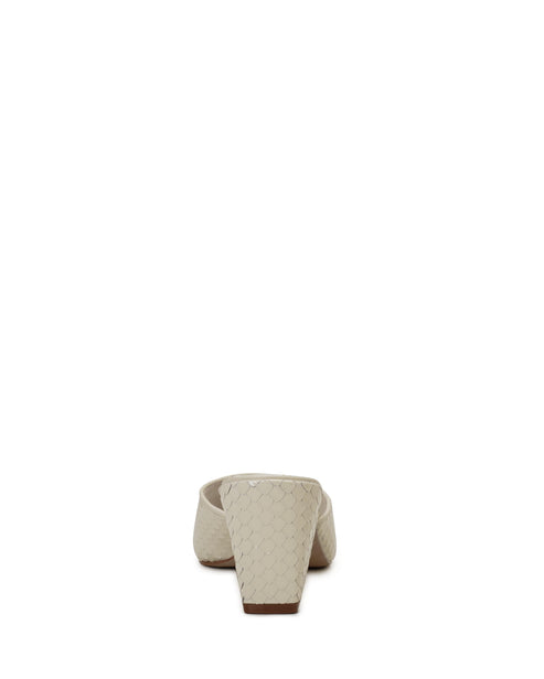Beige mule with a block heel.