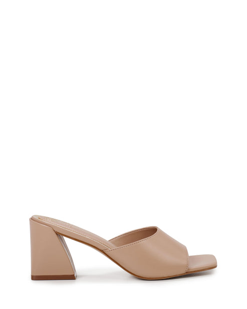 Beige heeled mule with a wide strap and block heel.