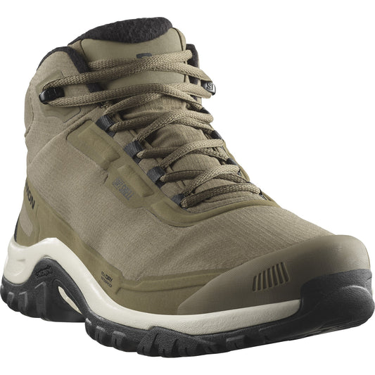 Tan-colored hiking boot with a high ankle, dark laces, and a thick treaded sole.