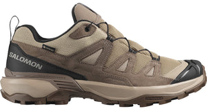 Tan and brown hiking shoe with black accents featuring a GORE-TEX label and 'SALOMON' on the back.