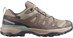 Low-top hiking shoe, tan with brown suede panels and black accents, visible 'SALOMON' logo, 'GORE-TEX' tag.