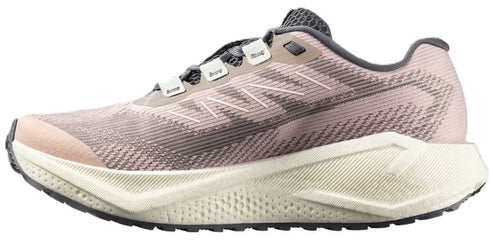 Running shoe with a beige sole, light pink and gray striped upper, and gray laces.