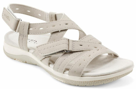 Slingback sandal in light taupe featuring adjustable straps with buckle and velcro closures.