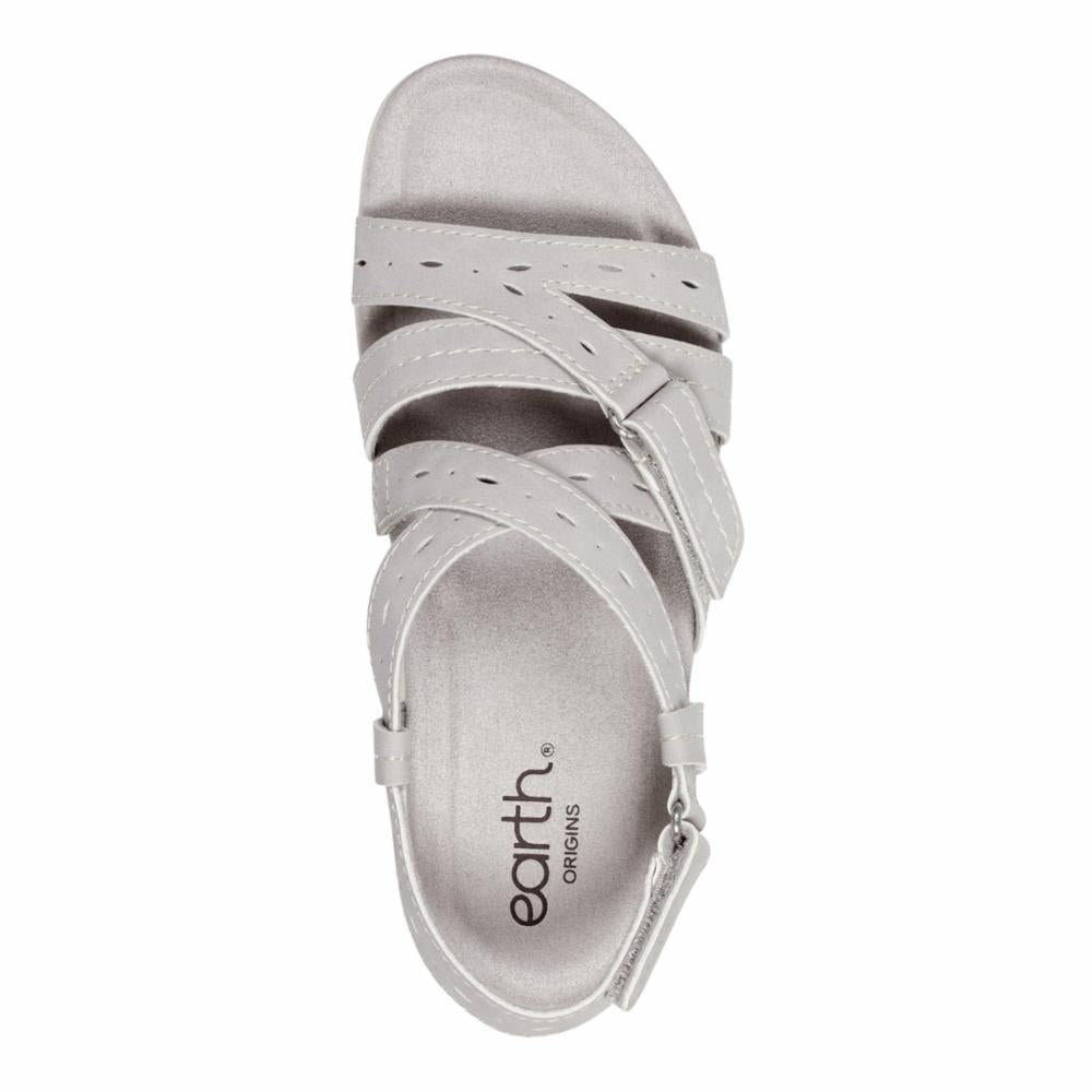 A gray sandal with multiple straps and visible logo "earth. ORIGINS" on the insole.