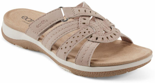 Beige sandal with interwoven straps and decorative cutouts.