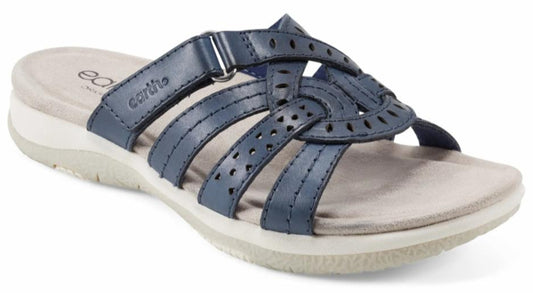navy blue sandal with interwoven straps and a low, off-white platform sole