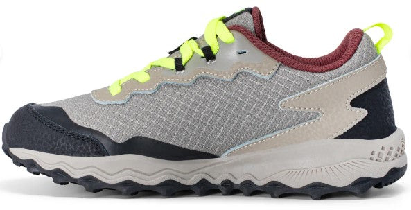 Grey and tan running shoe with neon yellow laces and black sole.