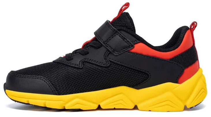 Black mesh sneaker with a red heel collar and yellow sole, featuring a hook and loop fastener.