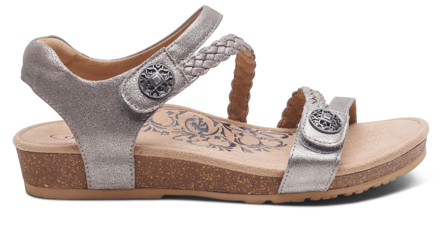 Silver sandal with adjustable hook-and-loop straps and decorative buttons.