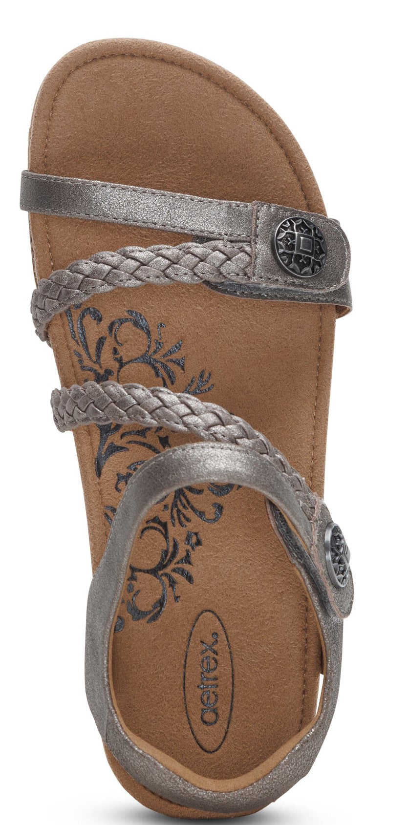 A top-down view of a sandal featuring a braided strap, a metallic sheen, and decorative embellishments.
