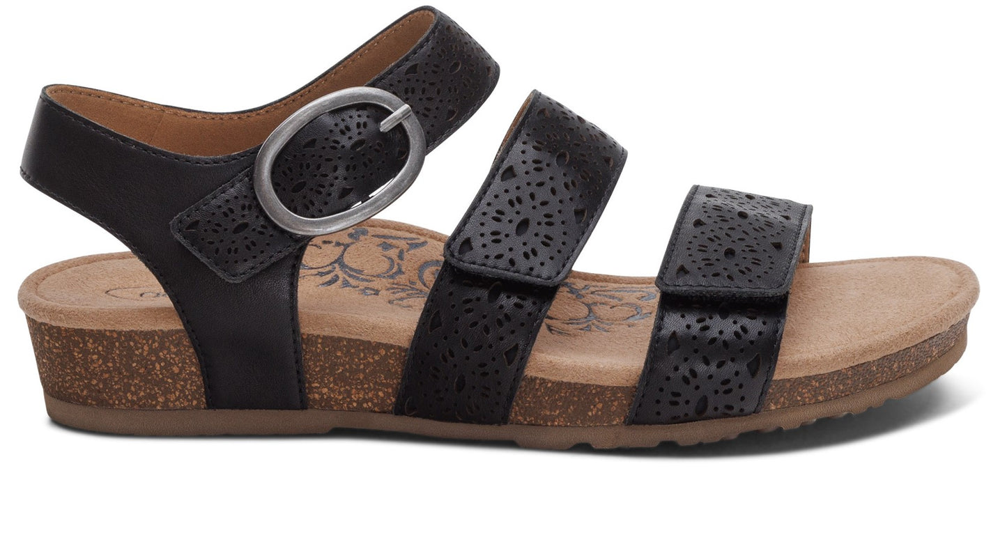 Black sandal with three perforated straps and a buckle.