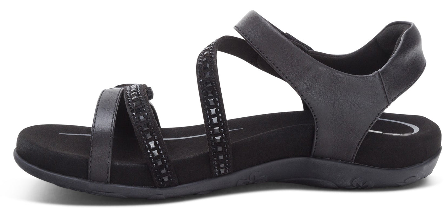 A black sandal with multiple straps.