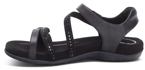 A black sandal with multiple straps.