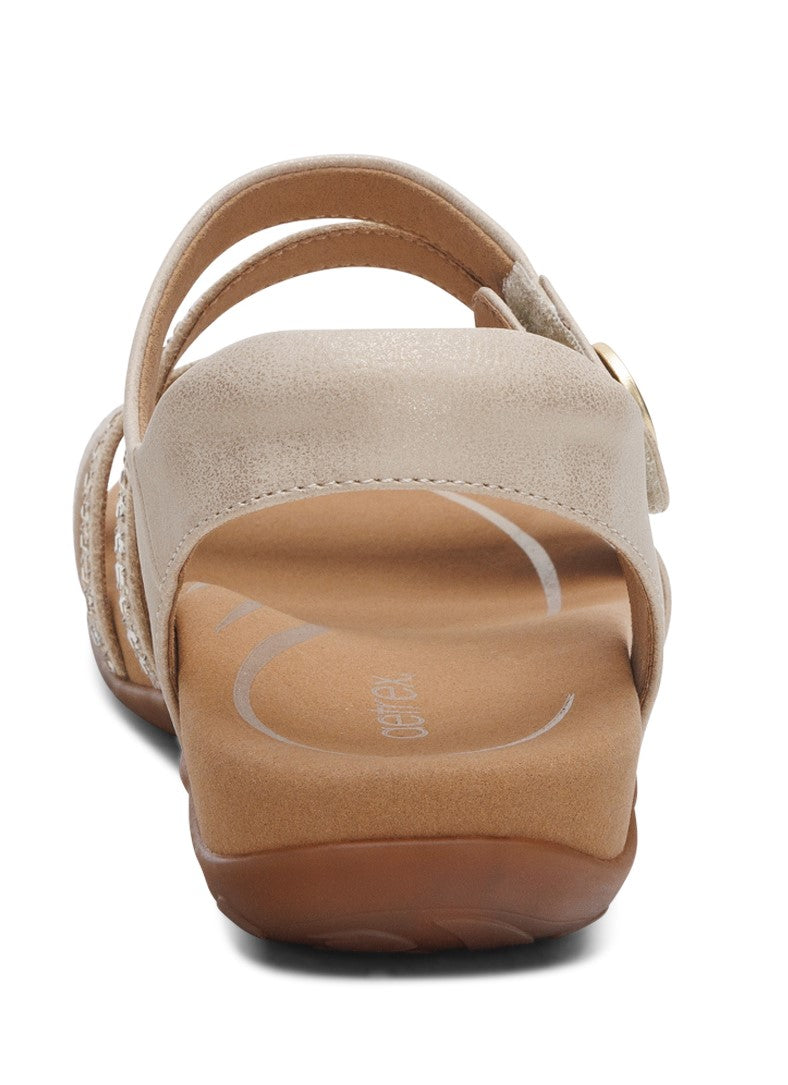 Rear view of a tan sandal with multi straps and an adjustable ankle strap.