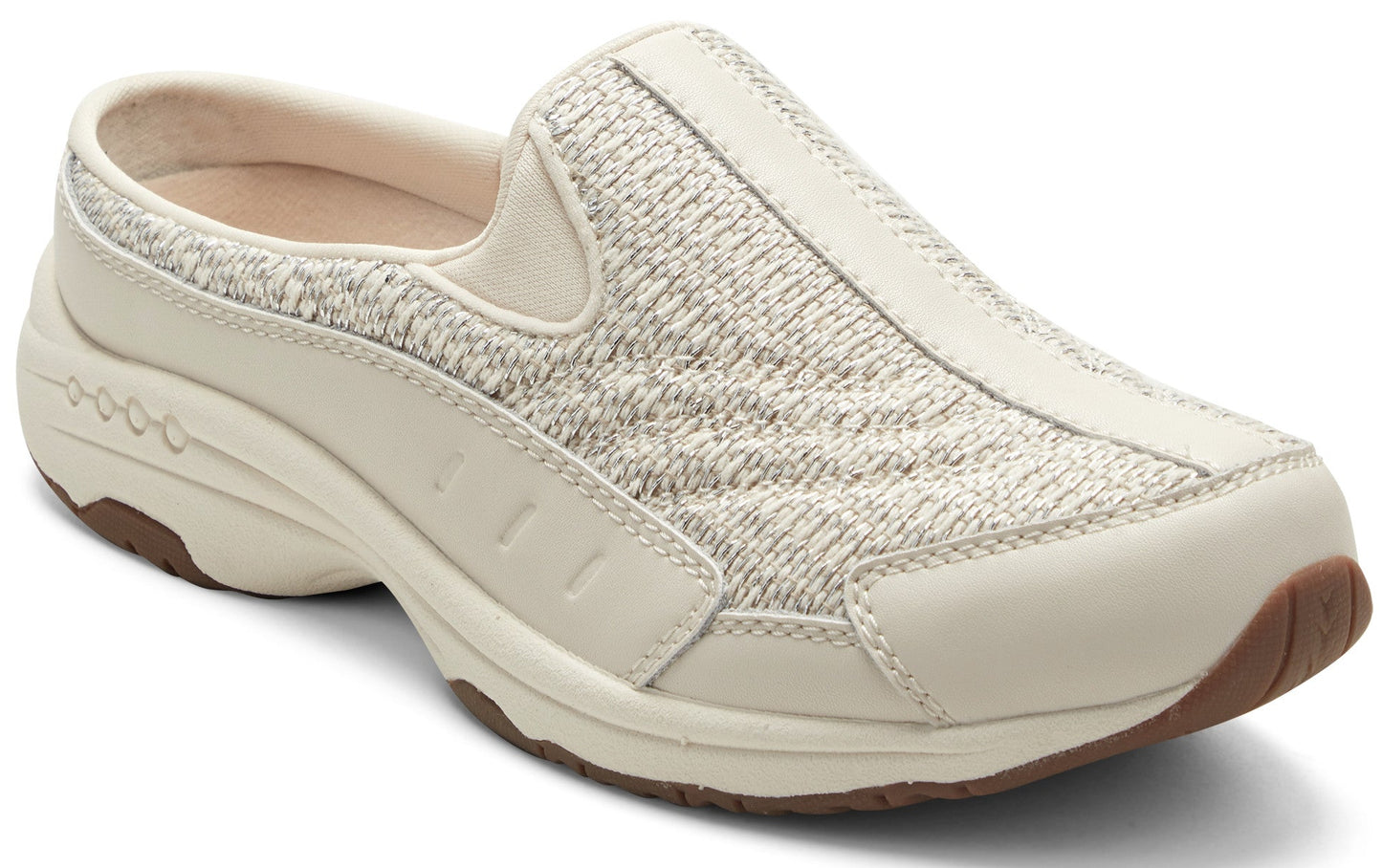 A cream-colored slip-on shoe with a knit upper and leather trim.