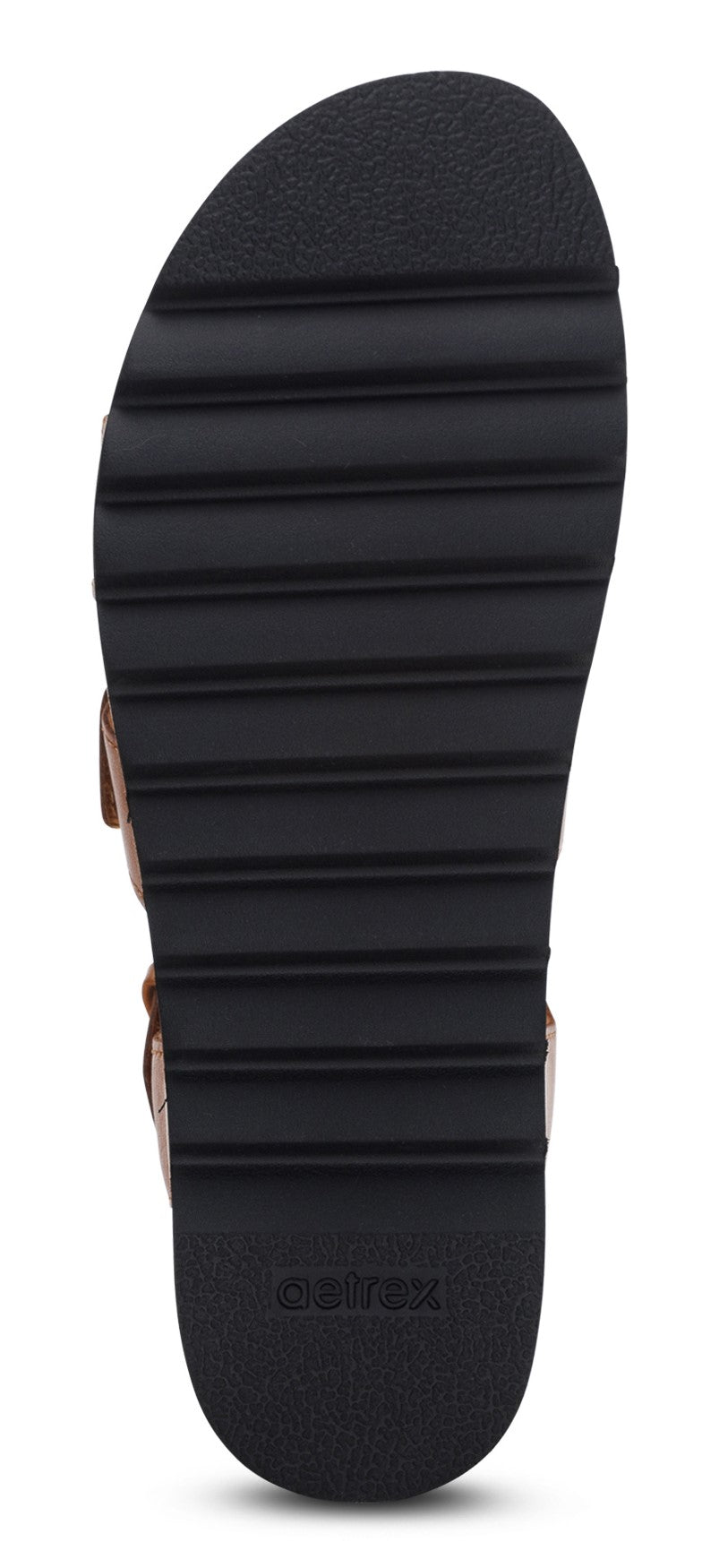 The sole of a sandal with thick treads.