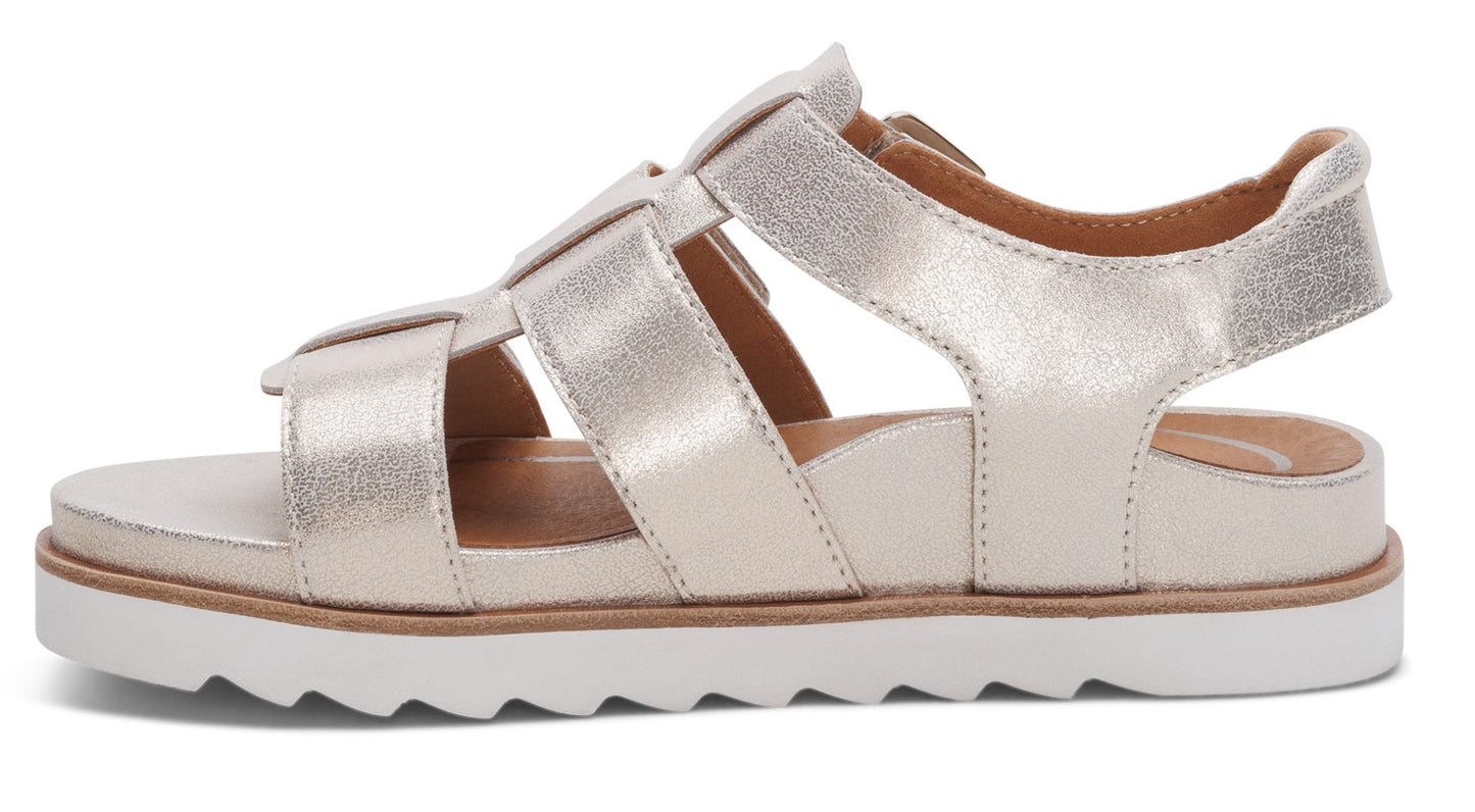 Gold sandals with woven straps and a white platform sole.
