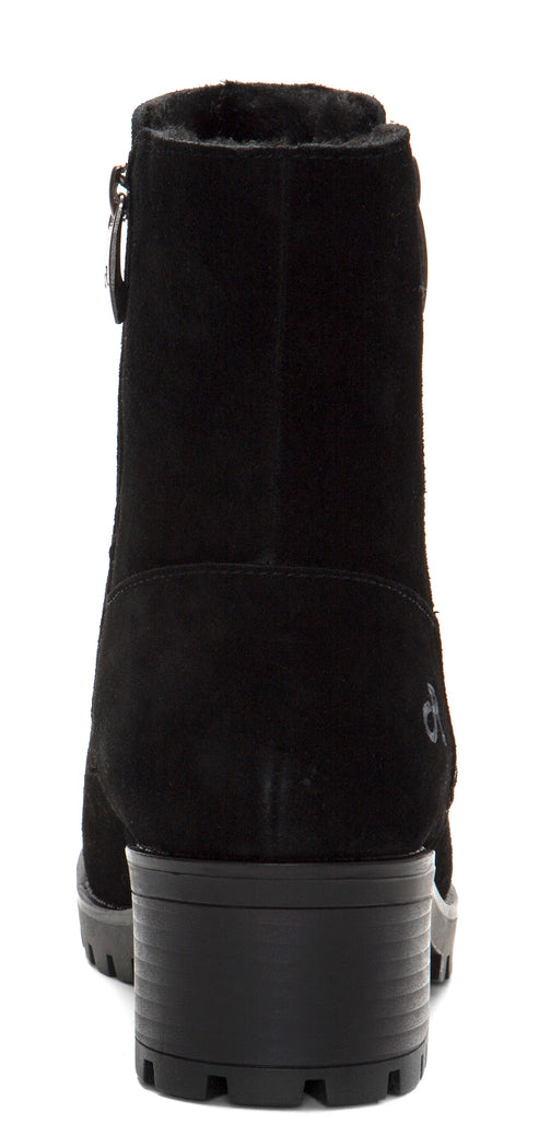 Back view of a black boot with a zipper and a lug heel.