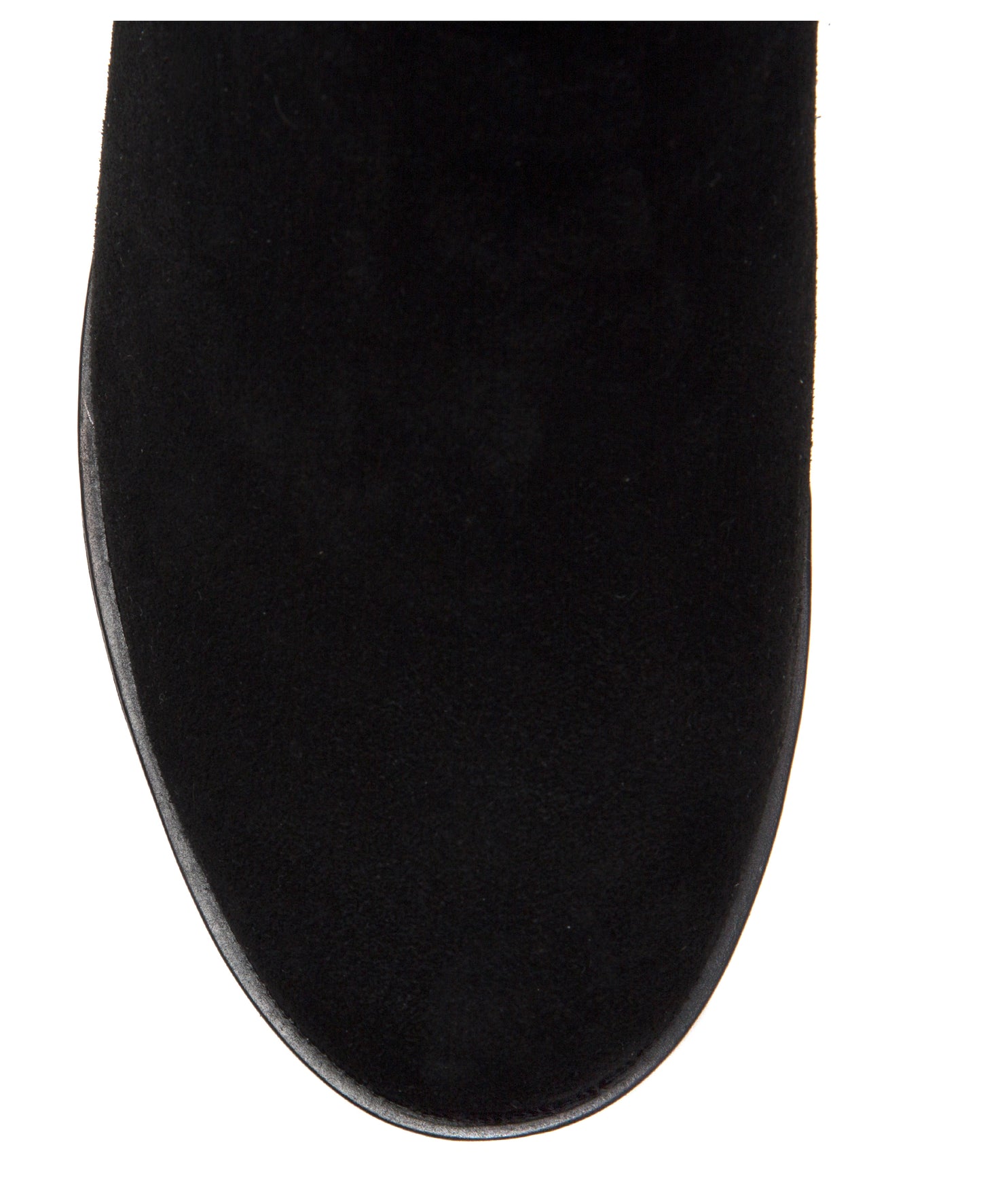Close-up of black suede boot toe.