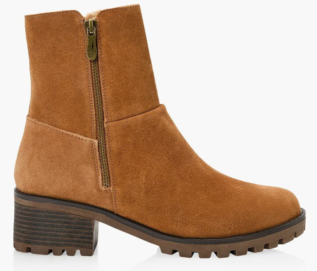 Suede ankle boot in caramel color with zipper closure and lug heel.