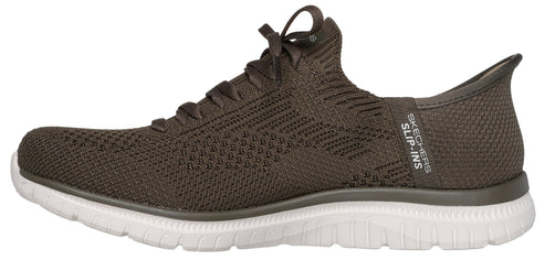 A slip-on walking shoe in an olive color with white soles, with visible text "SKECHERS SLIP-INS".