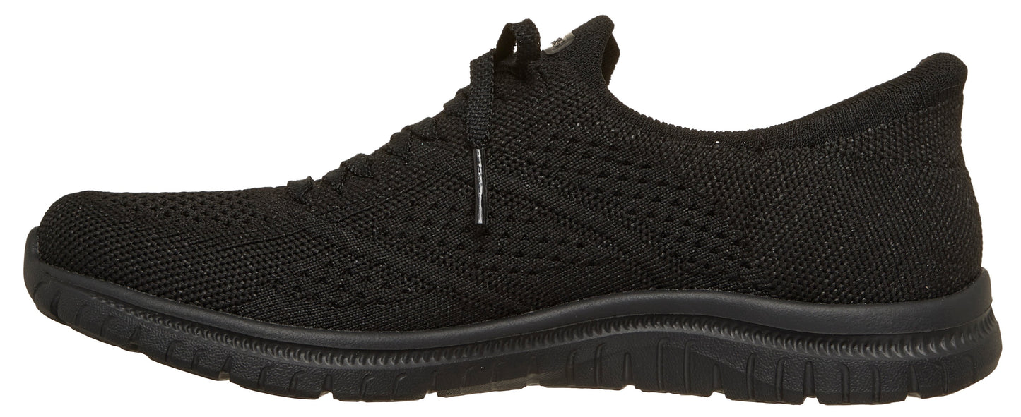 Black knit shoe with a textured sole and rounded toe.