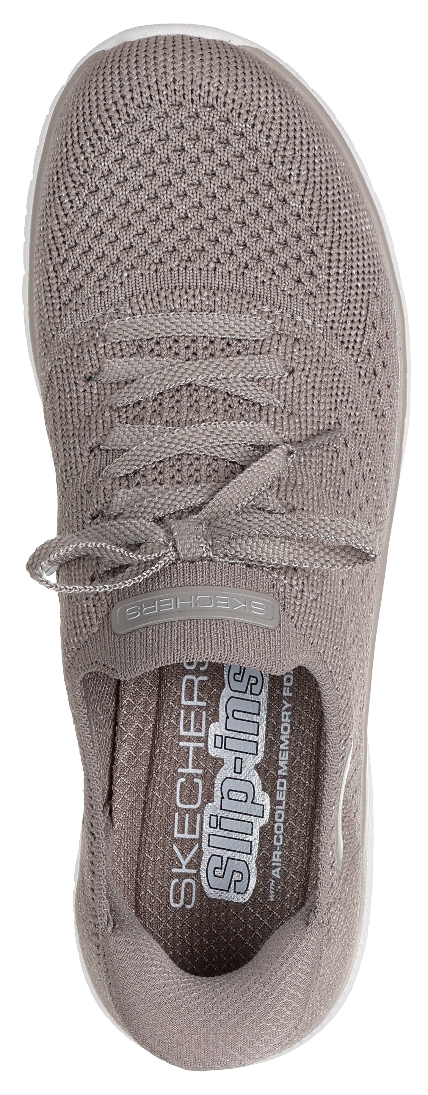 A taupe-colored slip-on shoe with visible laces and "slip-ins" printed on the inner sole.