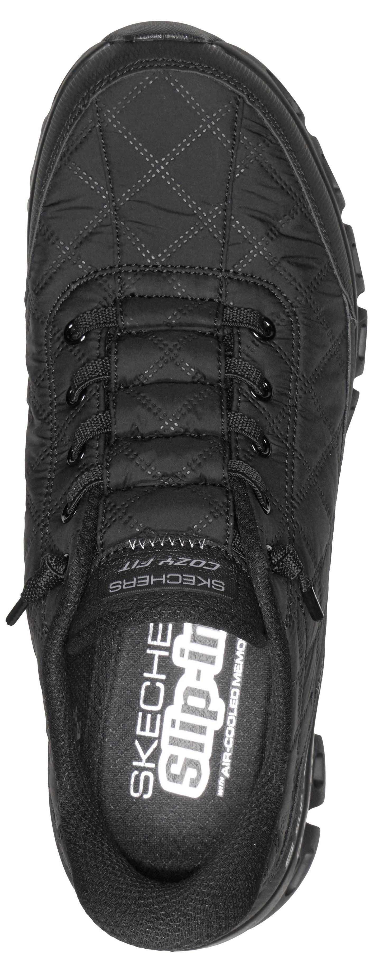 A top-down view of a black, quilted-style slip-on sneaker featuring a bungee lacing system, a padded collar, and visible branding that reads SKECHERS SLIP-INS and COZY FIT.