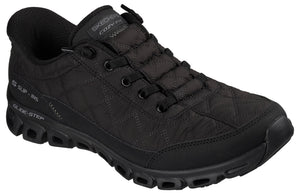 A black Skechers Glide-Step Cozy Fit sneaker with a quilted upper, lace-up front, and a thick, hollowed-out black rubber sole.