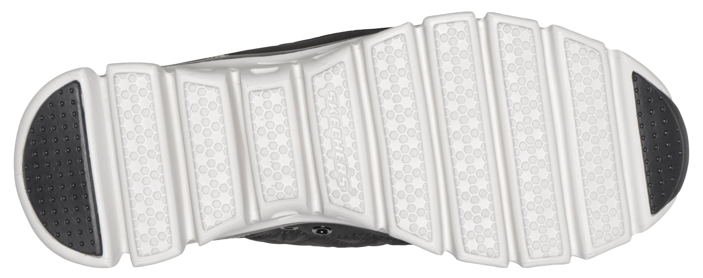 The sole of a shoe, with a pattern of white bars separated by gray rubber.