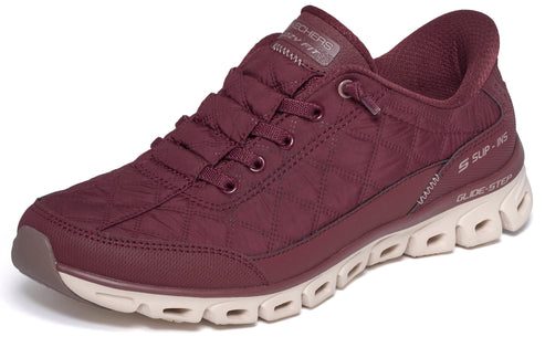 A maroon quilted slip-in sneaker with a beige Glide-Step sole, featuring a lace-up look and subtle branding on the tongue and side.