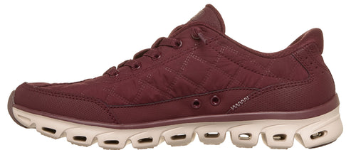 A quilted maroon low-top athletic sneaker with light beige, heavily vented soles.