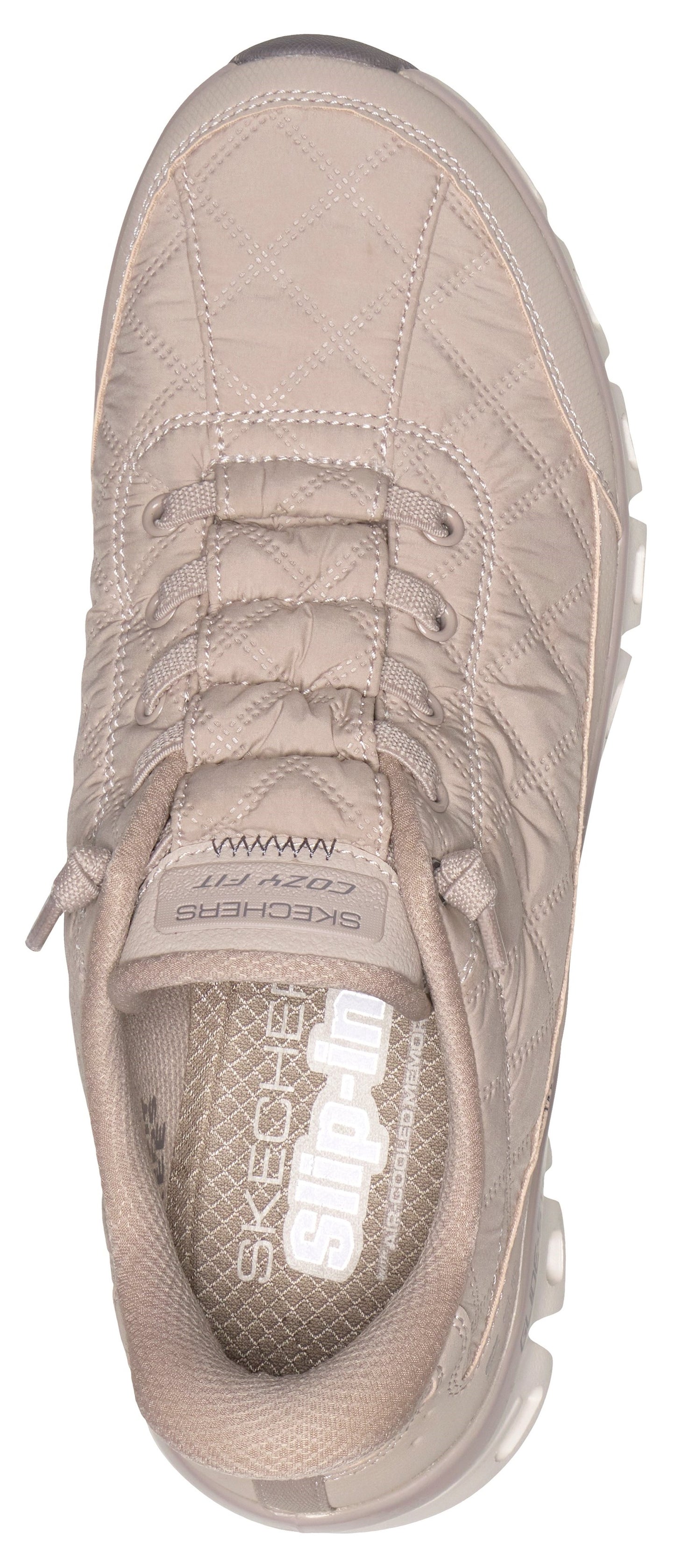 A top-down view of a beige quilted slip-on sneaker featuring a patterned insole and text that reads 'SKECHERS' and 'slip-ins' inside the footbed and on the tongue.