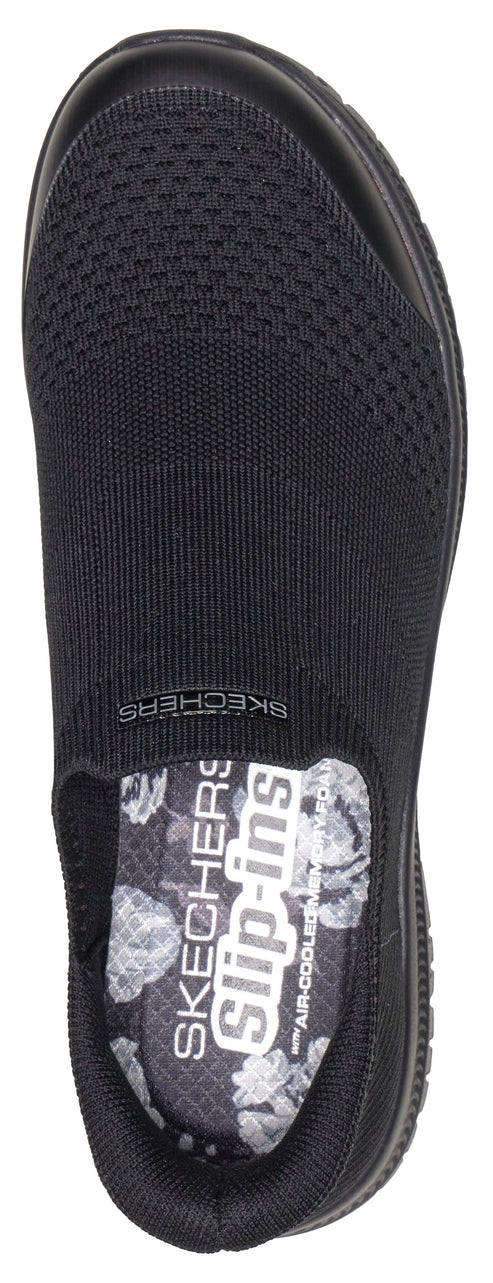 Black slip-on shoe with knit upper and floral insole.