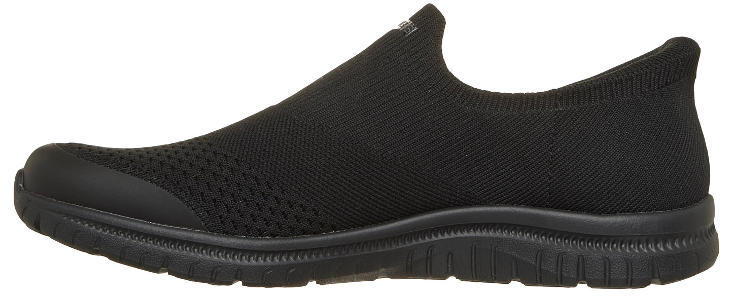 A black slip-on shoe with a textured upper and a low profile.