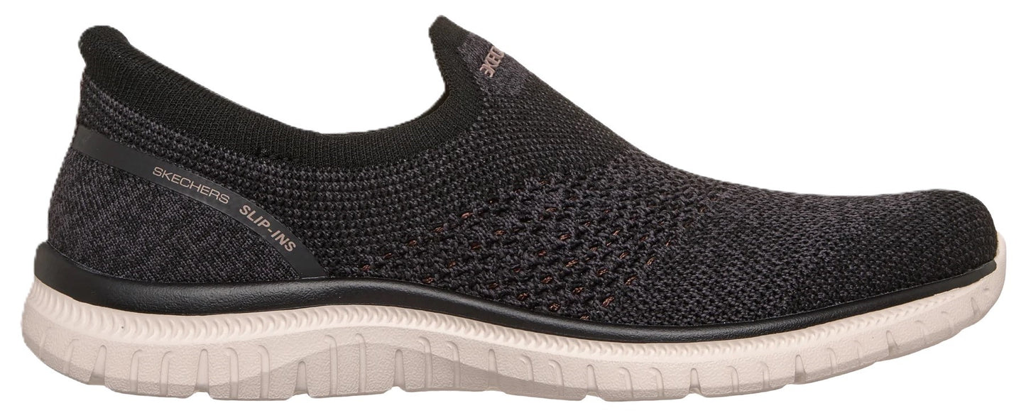 A black slip-on athletic shoe with a knit upper, a ribbed collar, and a textured white sole, featuring the text 'SKECHERS SLIP-INS' printed on the heel area.