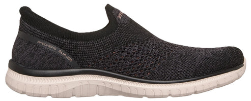 A black slip-on athletic shoe with a knit upper, a ribbed collar, and a textured white sole, featuring the text 'SKECHERS SLIP-INS' printed on the heel area.