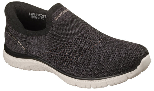 A charcoal-grey, knit-mesh slip-on sneaker with a white, flexible athletic sole and black trim, featuring 'SKECHERS' and 'HANDS FREE' text branding on the interior and heel.