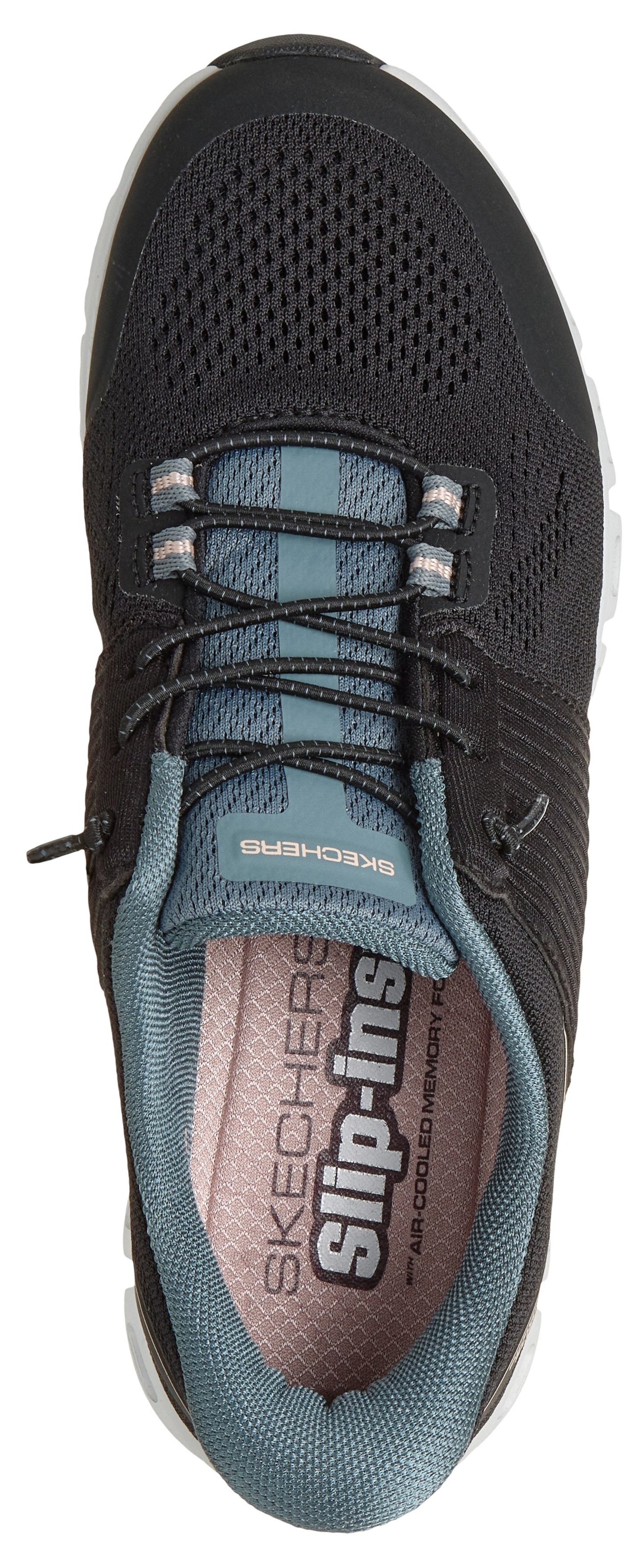 A top-down view of a dark grey Skechers Slip-ins athletic sneaker with a mesh upper, elastic laces, and a blueish-grey tongue and interior lining, featuring the words 'Skechers Slip-ins' printed clearly on the insole.