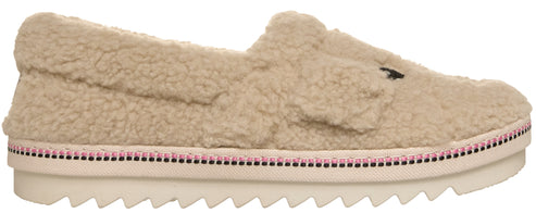 A slip-on shoe made of beige fuzzy sherpa material with a thick white platform sole that has a line of pink crystal embellishments along the upper edge.