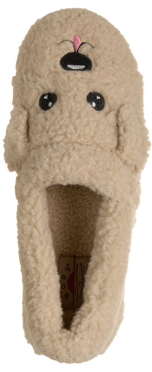 A fuzzy, tan-colored plush slipper shaped like a poodle's face, featuring dark eyes, a nose, and a small pink tongue sticking out.